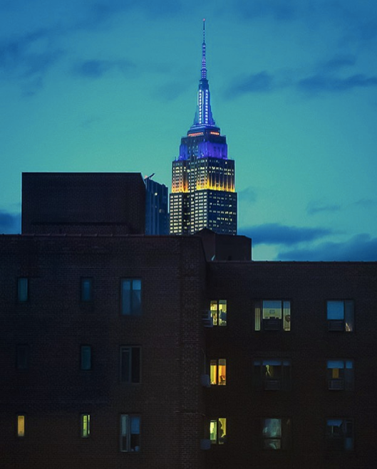 A photograph of the Empire State Building at night.