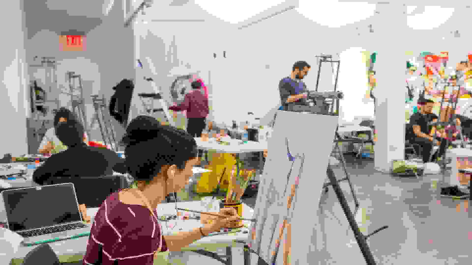 Students painting in the BFA Fine Arts studio.